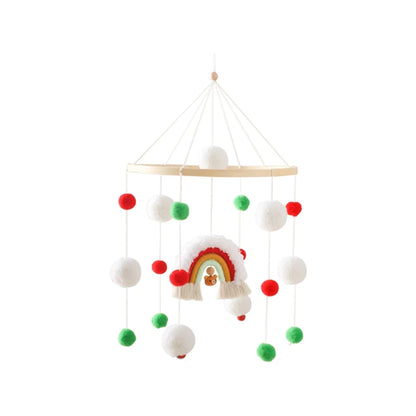 Mobile pour bébé avec pompons colorés et éléments arc-en-ciel suspendus, parfait pour éveiller et décorer le berceau.